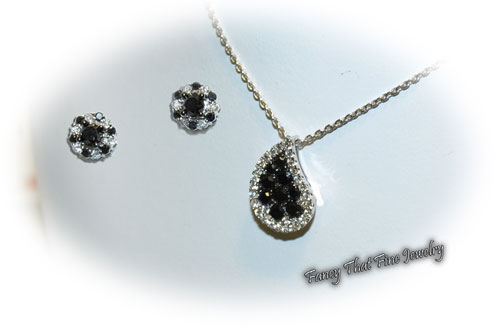 <b>Description: </b>14kt  white gold black and white diamond earrings and pendant