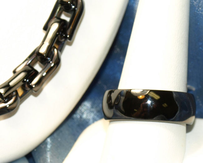 <b>Description: </b>Gents stainless and black enamel ring and necklace.(Call or e mail for price and details.)